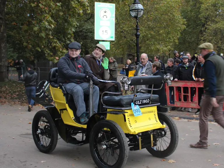 The De Dion-Bouton is pictured participating in the London to Brighton Veteran Car Run.