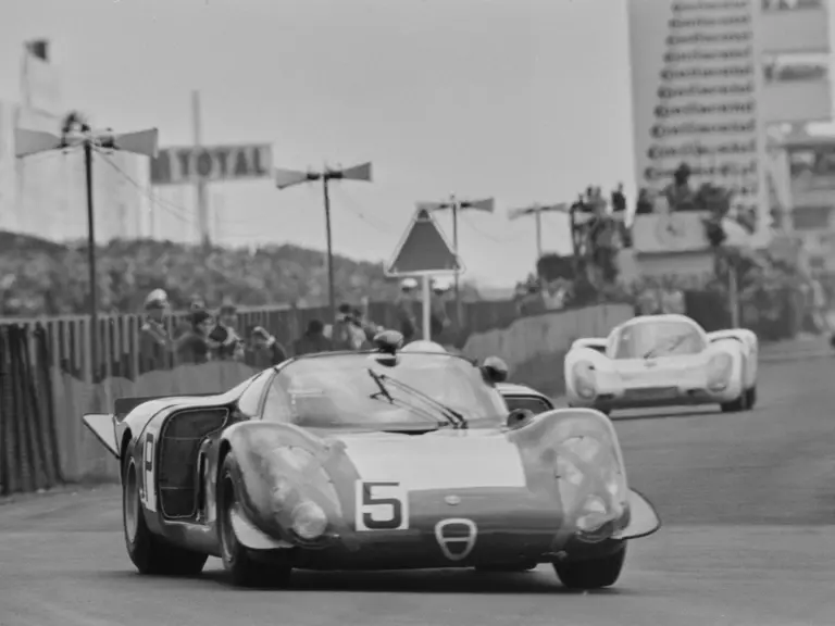 Chassis no. 015, race #5, leads a Porsche 907 into a turn at the 1968 Nürburgring 1000 KM. Chassis no. 015 was driven by Udo Schutz and Lucien Bianchi to a 4th in class and 7th overall finish.
