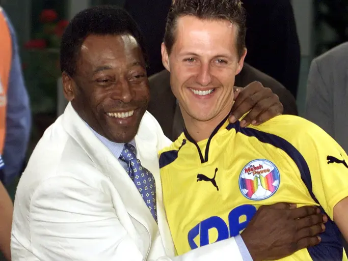 Michael Schumacher next to football legend Pele during the 2000 Match for Peace. This image is for reference purposes only.