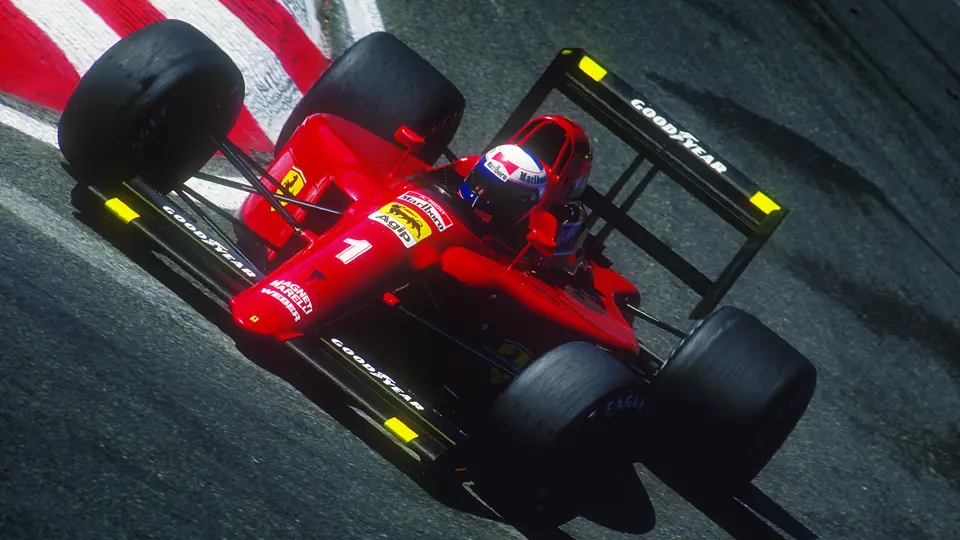Chassis 121, with Alain Prost behind the wheel cornering hard at the 1990 Spa-Francorchamps Grand Prix.