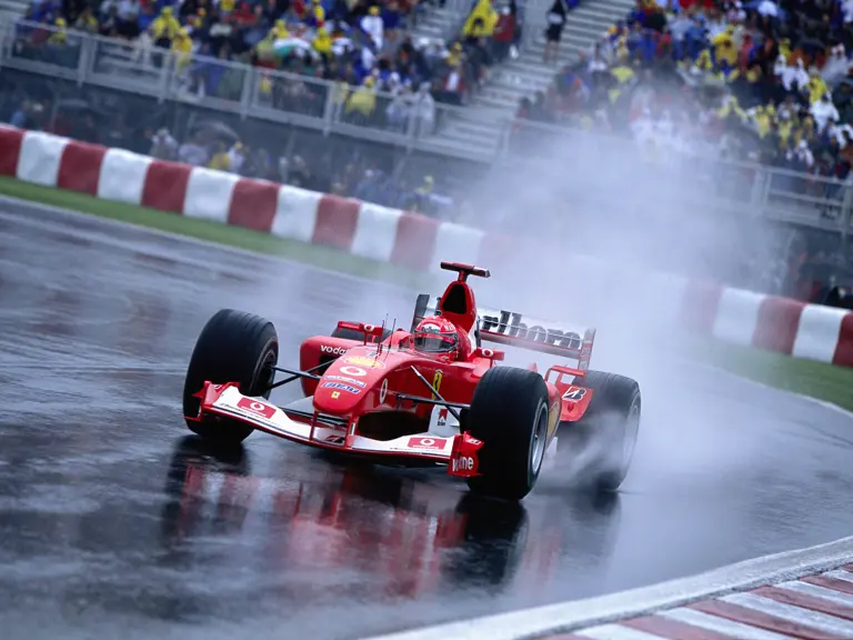 Michael Schumacher drives through the rain on his way to victory at the 2003 Canadian Grand Prix.