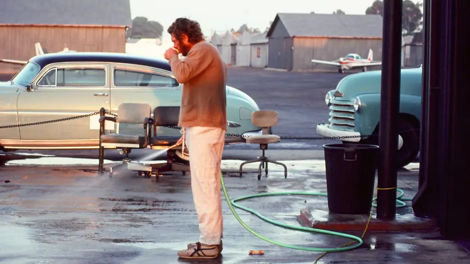 Steve McQueen with his 1952 Hudson Wasp proudly parked outside his hanger at the Santa Paula airport. Steve McQueen with his 1952 Hudson Wasp proudly parked outside his hanger at the Santa Paula airport.