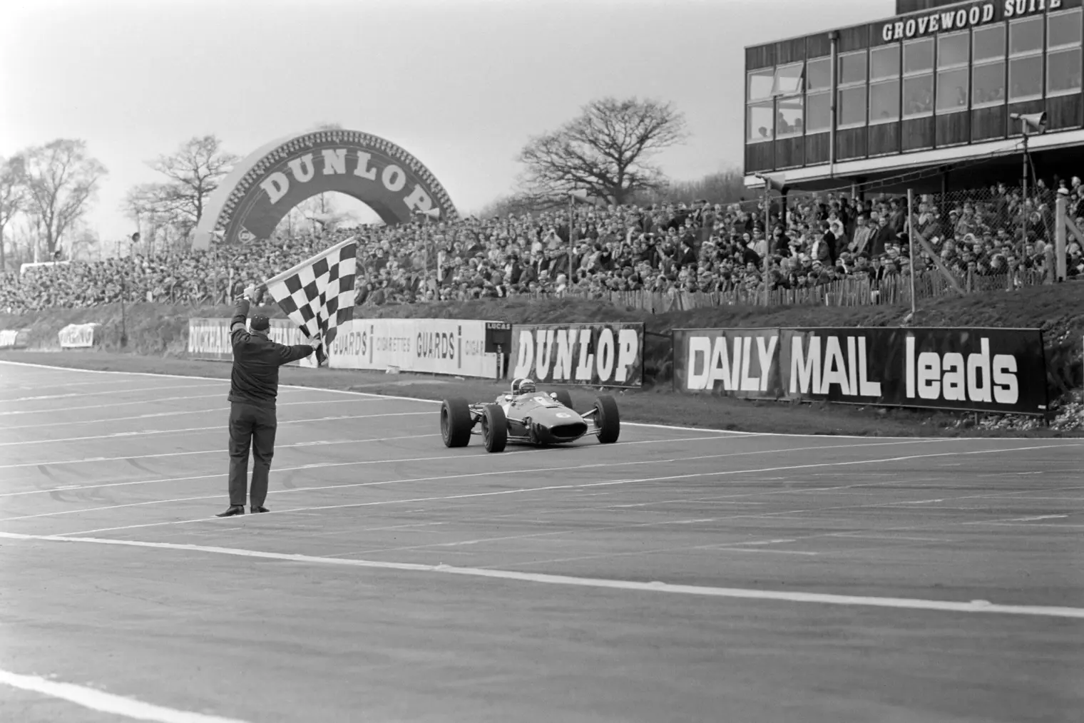 Rich Ginther crosses the line at the 1967 Race of Champions at Brands Hatch.