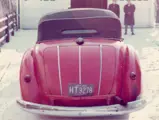 The Alfa Romeo wears its hood up to shield against the Chicago snow in the 1960s.