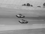 Chassis no. 5893, #22 (bottom car), at the 1966 24 Hours of Daytona driven by Bob Bondurant and Jochen Rindt.
