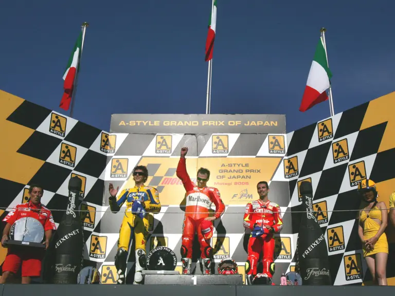 Loris Capirossi, Valentino Rossi, and Marco Melandri during the awards ceremony after the 2006 Grand Prix of Japan.