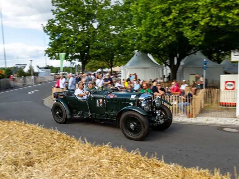 The Bentley is captured participating in the Classic Days event at Schloss Dyck.