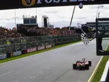 Michael Schumacher, Ferrari F2001, celebrates as he crosses the finish line and takes the chequered flag during the Australian GP at Melbourne Grand Prix Circuit on March 03, 2002 in Melbourne Grand Prix Circuit, Australia.