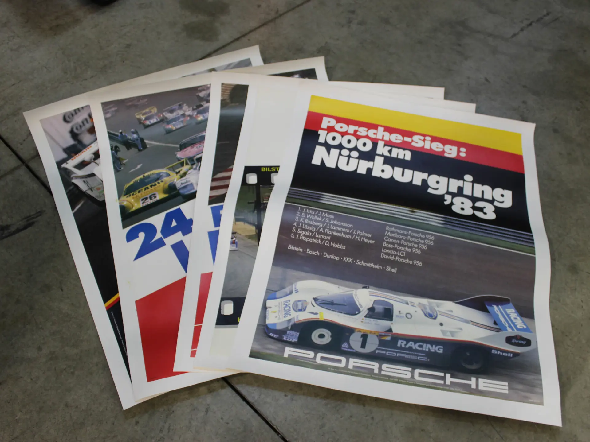 five-porsche-posters-ca-1980s-1990s-open-roads-october-2021-rm