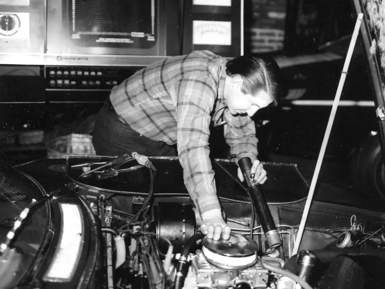 The LT1 engine is carefully lowered into the Iso Grifo at Motion Performance in 1970.