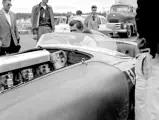 Carroll Shelby grins at the sweet sounds being made by his Ferrari, chassis no. 0478 AM (#103), in the paddock before the start of the feature race at the 31 July 1955 SCCA Nationals held at Bremerton, Washington.