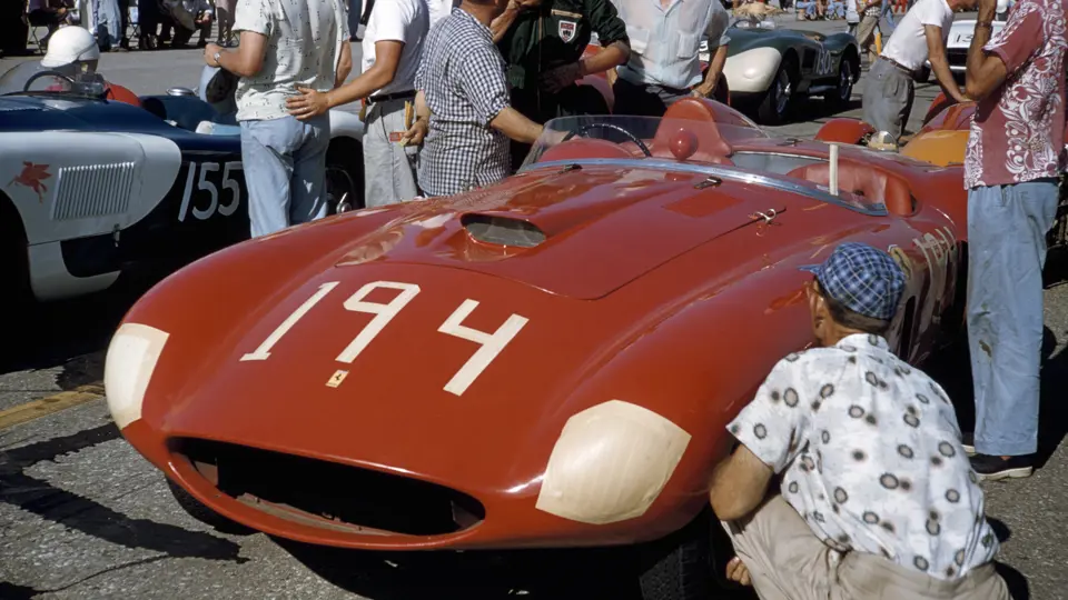 Chassis no. 0478 AM donning #194 with owner Tony Parravano (hat and checkered shirt) and driver Ken Miles (green race suit) chatting prior to the Santa Barbara race, September 1955.