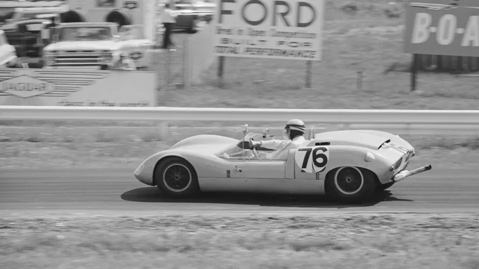Don Wester wrestles with the steering wheel of 70P/032 at Watkins Glen, 1964.
