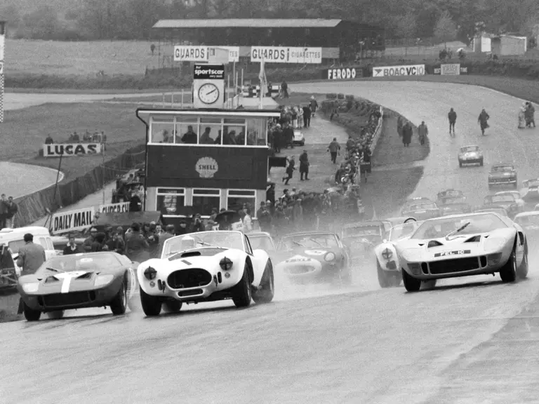 The team of Bob Bondurant and David Piper lead the way at Brands Hatch, 1966.