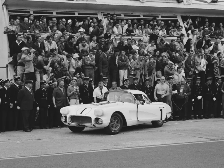 Cunningham fires up the #1 Corvette as Alfred Momo and the paddock crowd cheer him on.