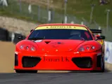 011 M at speed during the first round of the 2002 British GT Championship at Brands Hatch, where it finished fourth overall and third in class.