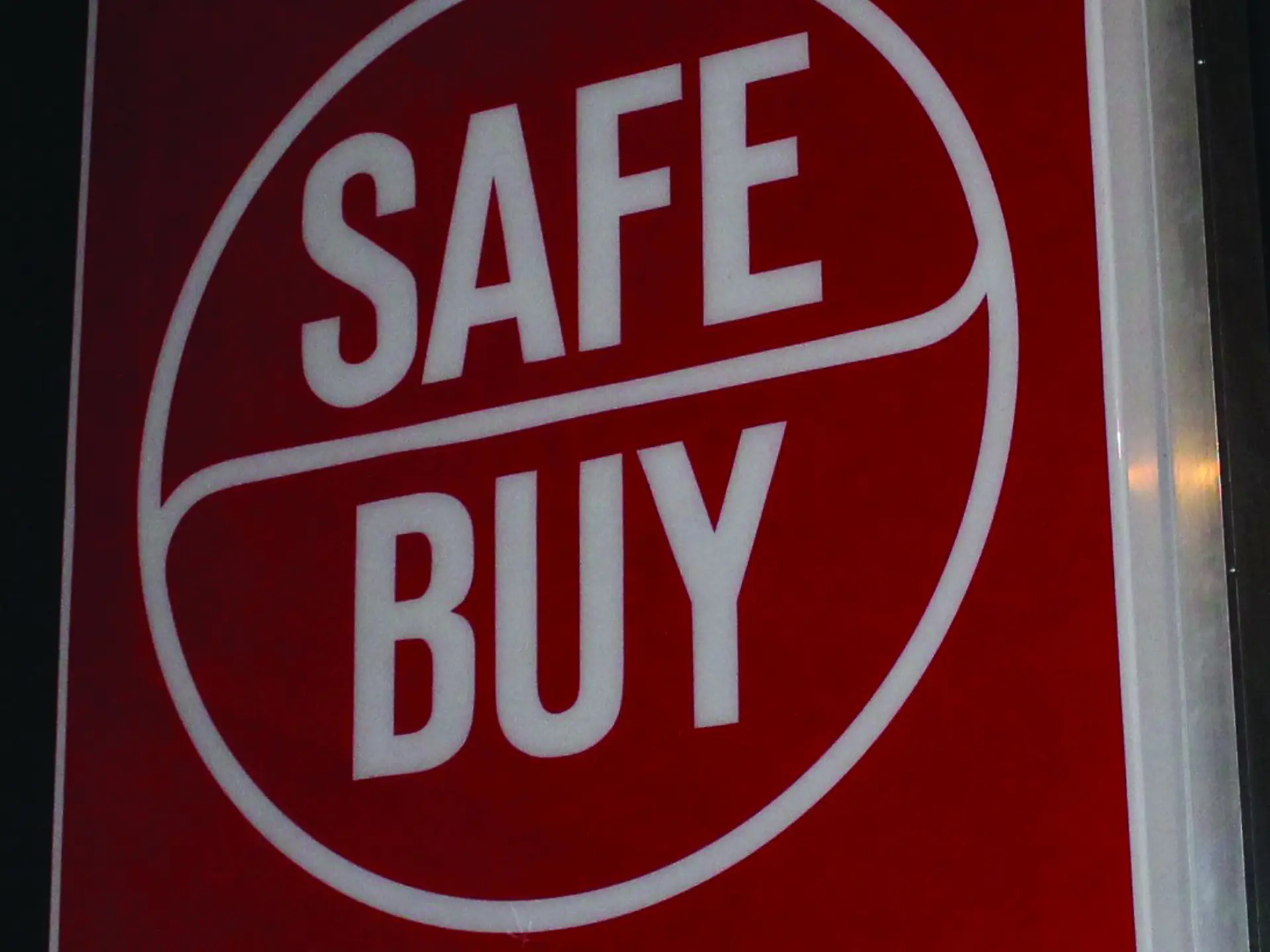 A "Safe Buy," (Used car emblem for Lincoln Mercury Dealers) illuminated