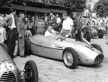 Toni Ulmen chats in the pit lane just before the start of the 1951 Swiss Grand Prix in Erlen, Switzerland.
