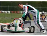 Michael Schumacher pushing his kart down the South Garda Karting track in Italy in 2009. This image is for reference purposes only.