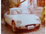 Hirotoshi Honda is pictured with the Lotus after its first rebuild, refinished in white.