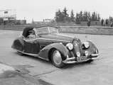 Pictured here at the Nürburgring Nordschleife in anticipation of the 1951 German Grand Prix, the 8C 2900 notably wears its Nowack cabriolet body at this point.