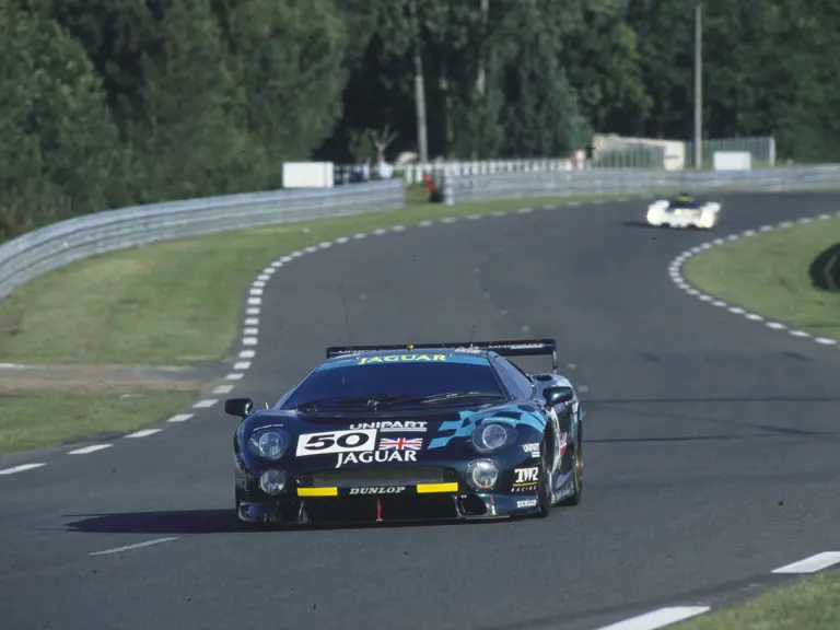 The Jaguar approaches the entry to The Porsche Curves during the 1993 24 Hours of Le Mans.