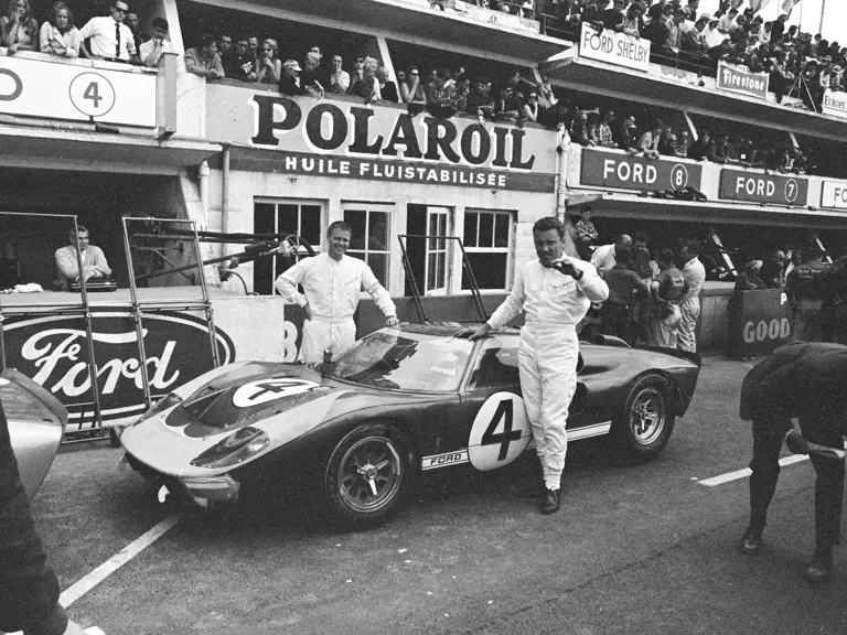 Holman-Moody’s #4 Ford GT40 Mk II (P/1032) and drivers Mark Donohue (left) and Paul Hawkins (right) at the 1966 24 Hours of Le Mans.