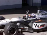 David Coulthard celebrates winning the 2001 Austrian Grand Prix.