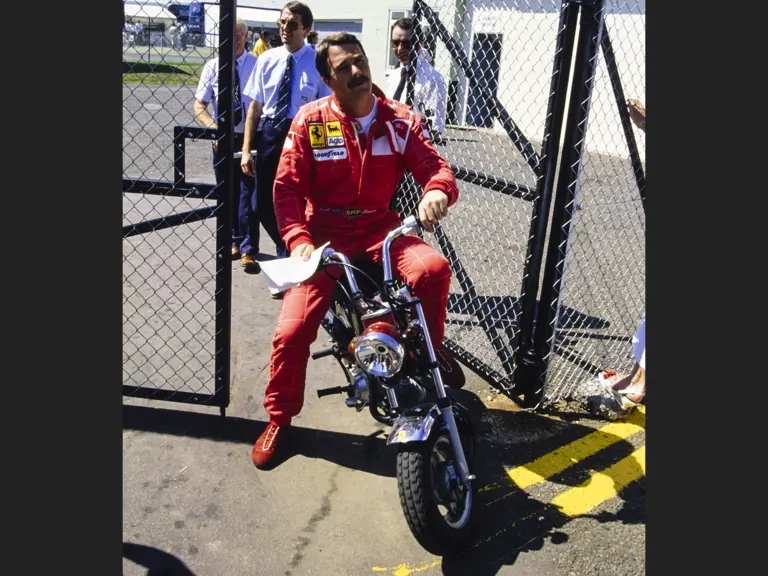 Nigel Mansell captured going through a gate at Silverstone Circuit before the 1990 British Grand Prix, he went on to claim pole position and set the fastest lap.