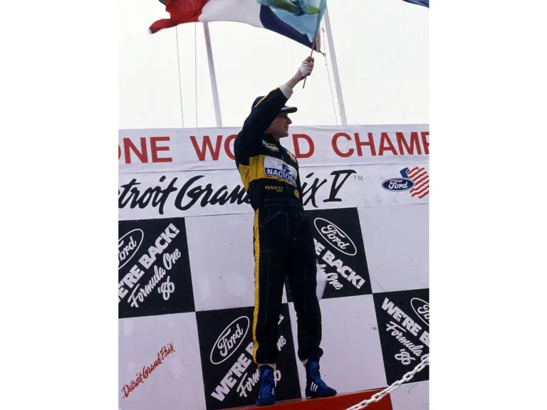 Ayrton Senna celebrates his victory at the 1986 Detroit Grand Prix.