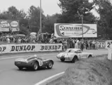 The #1 Corvette is pursued by the eventual 1960 24 Hours of Le Mans race-winning #11 Ferrari TR59 of Oliver Gendebien and Paul Frère.