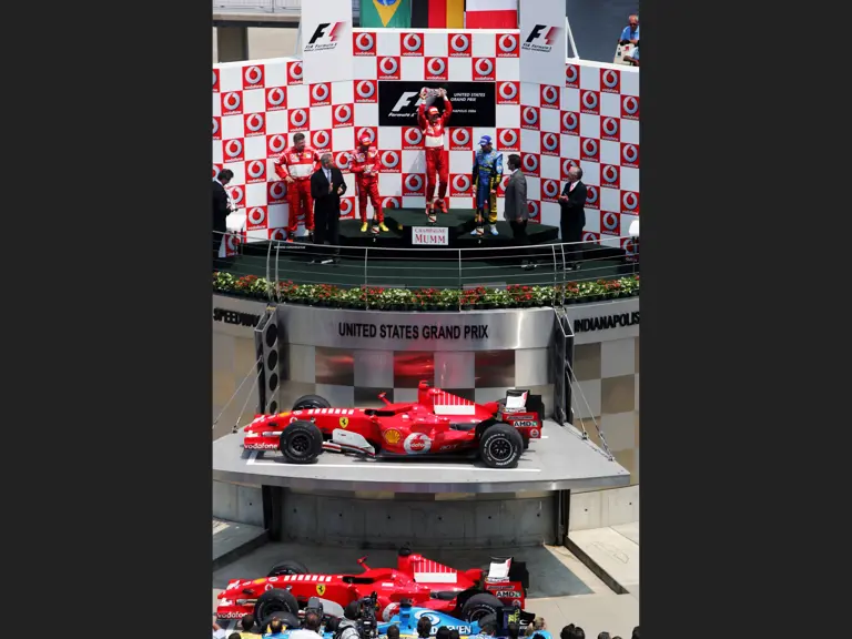 Michael Schumacher and Felipe Massa celebrate their 1-2 finish at the 2006 United States Grand Prix.