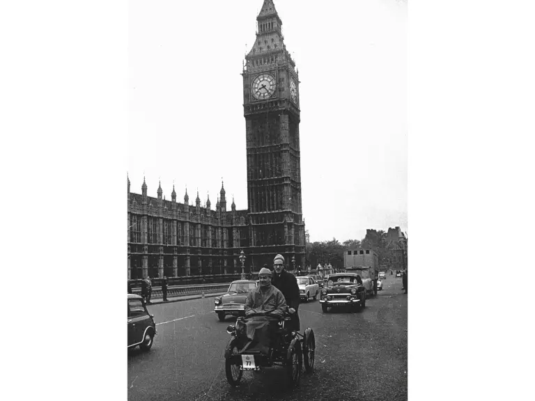 The De Dion trike passes Big Ben on the approach to Westminster Bridge in a 1960s edition of the London to Brighton Veteran Car Run.