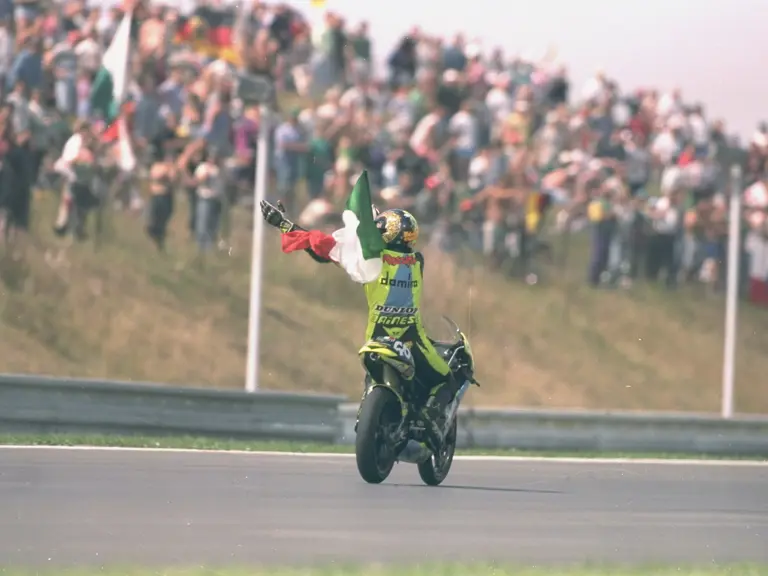 Valentino Rossi on his first career celebration lap having won the 1996 Czech Grand Prix with chassis 1291195.