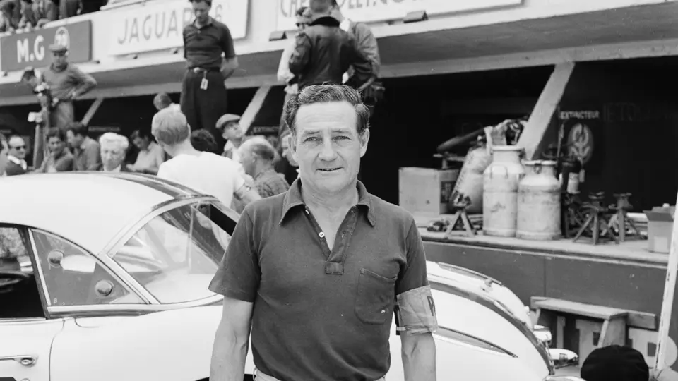 Briggs Cunningham takes a moment to pose in front of one of his three Corvettes before the 24 Hour of Le Mans begins.