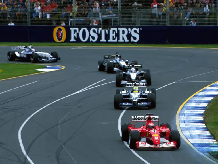 Race winner Michael Schumacher (GER) Ferrari F2001 leads brother Ralf Schumacher (GER) BMW Williams FW24, David Coulthard (GBR) & Kimi Raikkonen (FIN) McLaren Mercedes MP4/17 and Juan Pablo Montoya (COL) BMW Williams FW24.Australian Grand Prix, Rd1, Melbourne, Australia. 3 March 2002.