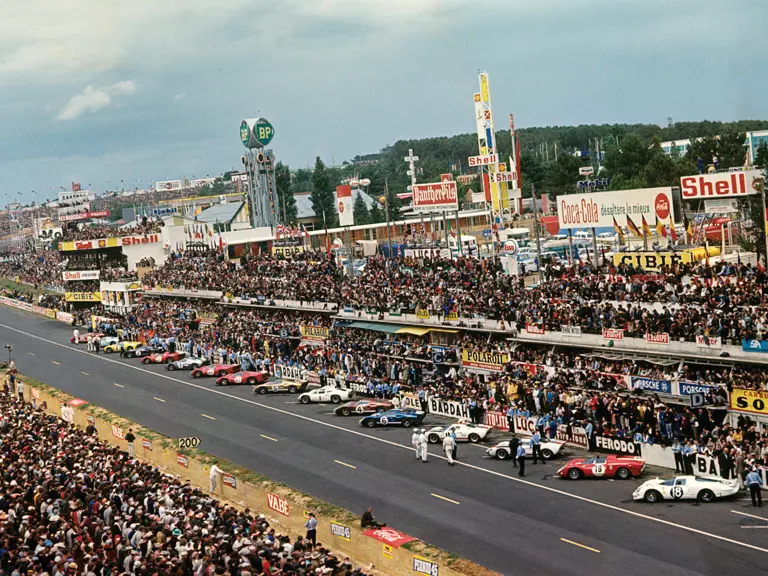 All lined up and ready to go, P/1016 stands out in its Kandy Gold livery at Le Mans in 1966.