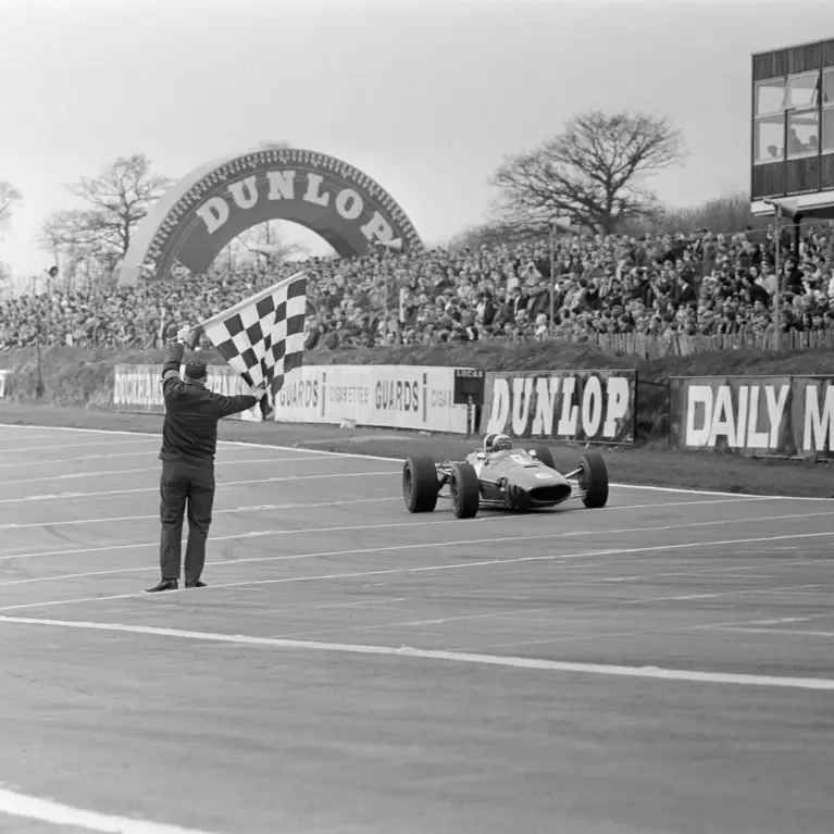 Rich Ginther crosses the line at the 1967 Race of Champions at Brands Hatch.