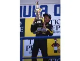 Ayrton Senna lifts the winner's trophy at the 1986 Spanish Grand Prix.