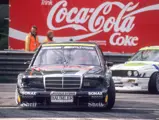 Schneider rounds a corner at the ADAC Avus on 8 May 1992 in the 190 E 2.5-16 Evolution II ahead of a BMW M3 Sport Evolution. He would set the fastest lap and take victory in Race 2 that weekend.