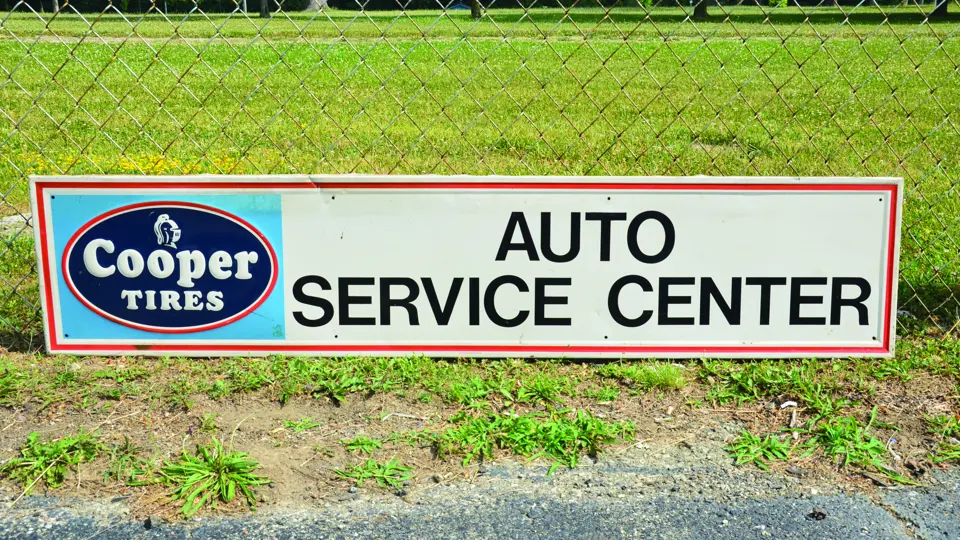 ‘Cooper Tires Auto Service Center’ sign | Auburn Fall 2016 | RM Sotheby's