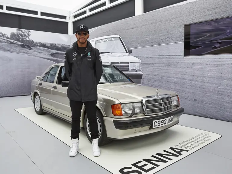 Then racing for Mercedes-AMG Petronas F1 Team, Lewis Hamilton stands with the Mercedes-Benz at the 2016 Australian Grand Prix.