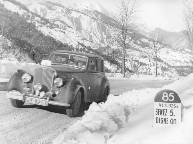 The Bentley R-Type Climbs a snowy hill during the 1953 Monte Carlo Rallye.