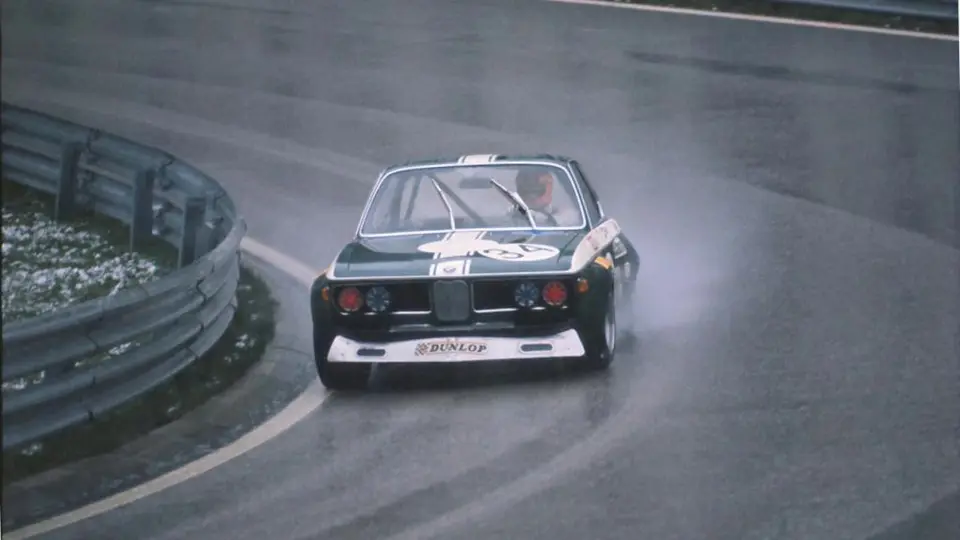 John Fitzpatrick hustles chassis 2211343 on its competitive debut to 3rd place at a sodden Salzburgring in April 1972.
