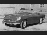 The Aston Martin is captured in period wearing its new coachwork by Serra.