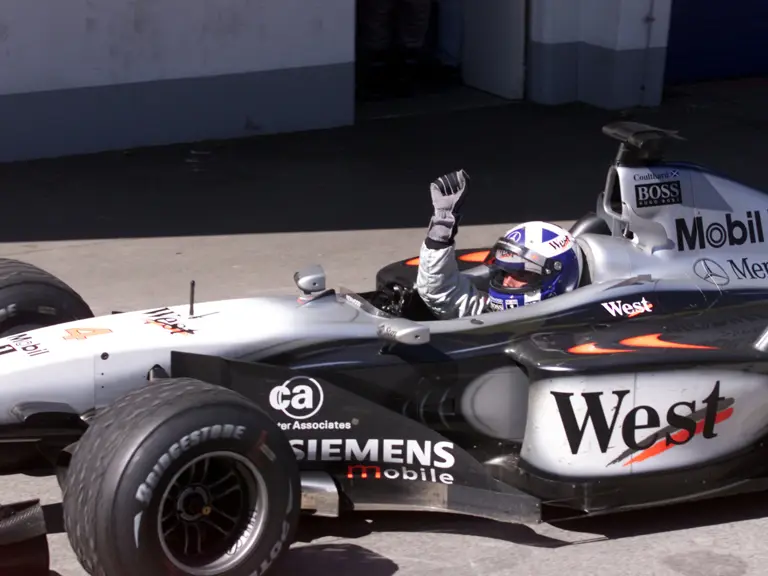 David Coulthard celebrates winning the 2001 Austrian Grand Prix.