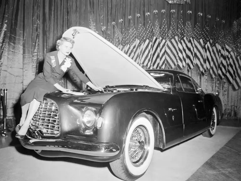 Chrysler engineer Lucille Pieti makes last minute adjustments on the new Chrysler D'Elegance at the Easter Parade of Stars at the Waldorf-Astoria in New York.