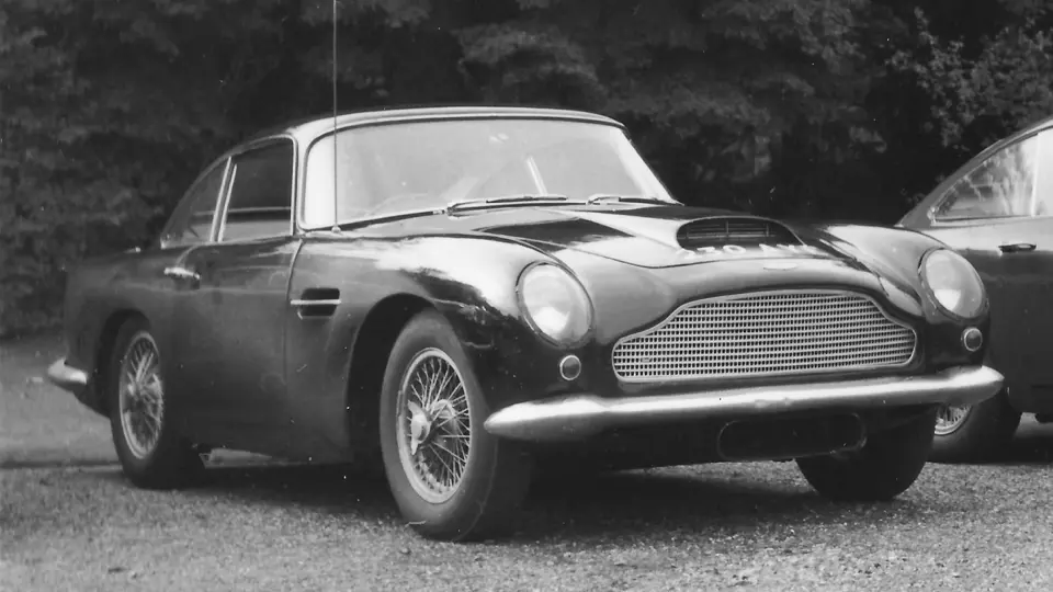 The DB4 GT is pictured in Fort Belvedere in 1969. When new, the car had rounded front bumpers and four cooling scoops.