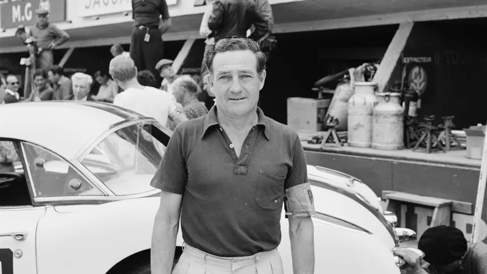 Briggs Cunningham takes a moment to pose in front of one of his three Corvettes before the 24 Hour of Le Mans begins.