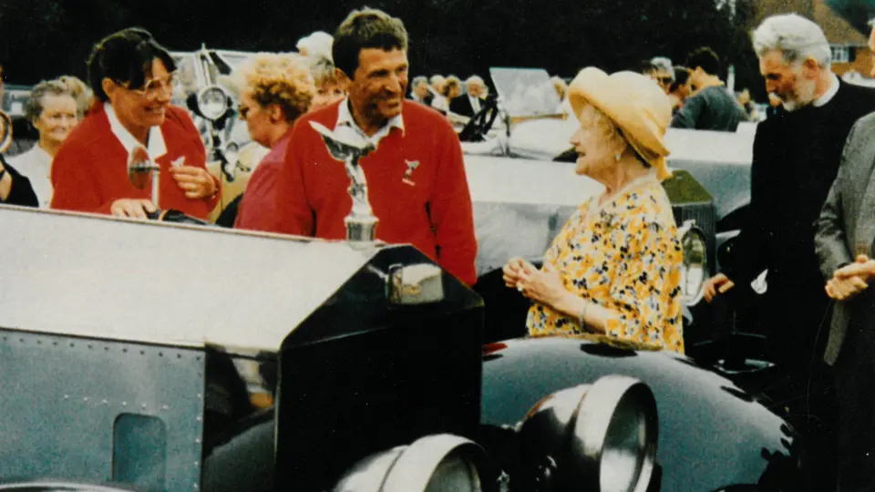 The consigning owner stands with the Silver Ghost in conversation with HRH Queen Elizabeth The Queen Mother, 1991. The consigning owner stands with the Silver Ghost in conversation with HRH Queen Elizabeth The Queen Mother, 1991.